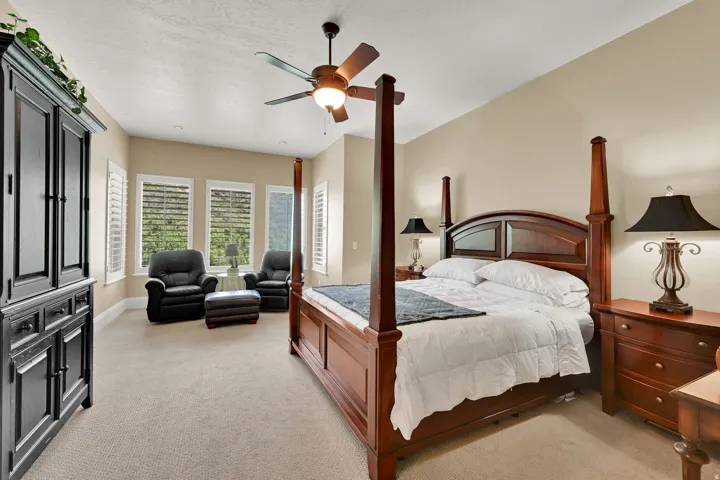 Oversized primary bedroom with seating area.