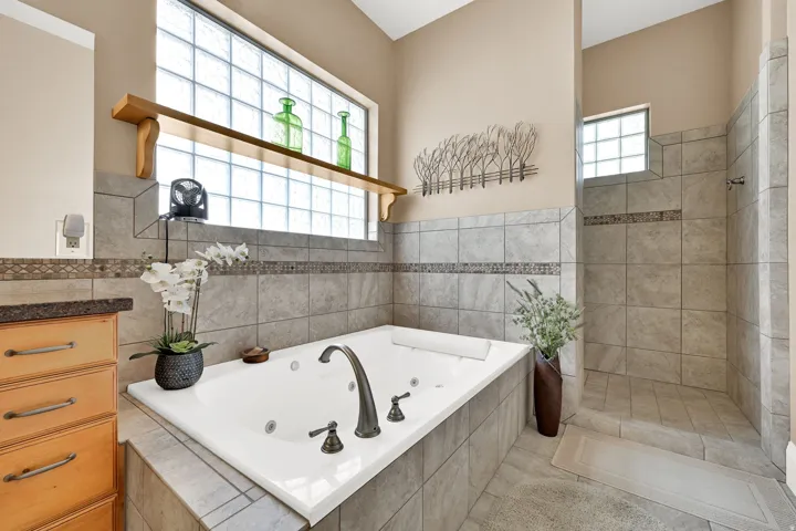A soaking tub and cave walk-in shower!