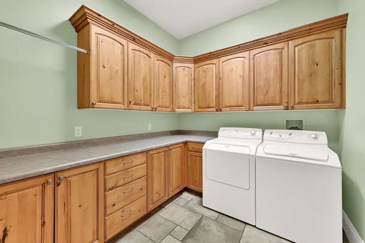 This laundry room is larger than what other homes would have for a bedroom.