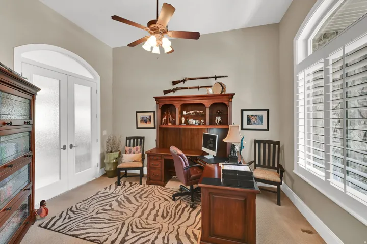 The frosted glass double doors and large picture window make this the ideal work place.