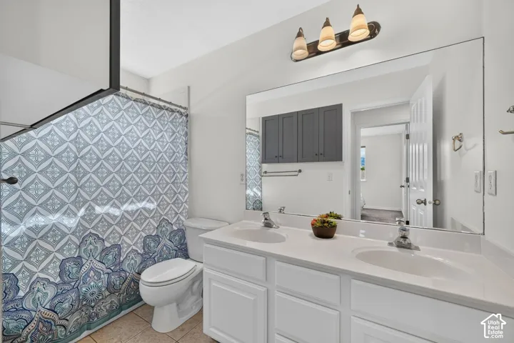 Double vanity with white cabinetry and integrated sinks