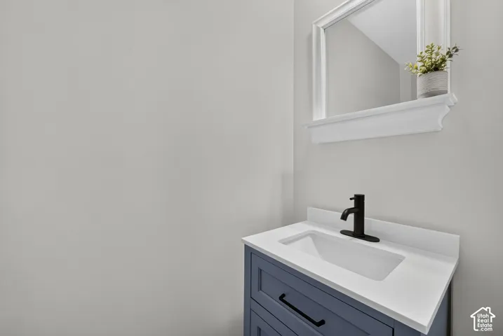 Contemporary vanity with a white countertop and integrated rectangular sink