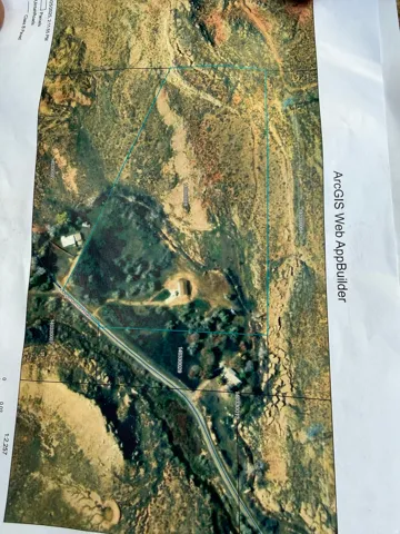 ArcGIS Web AppBuilder Map. Depicting an aerial view of the property with boundary lines and identifying features