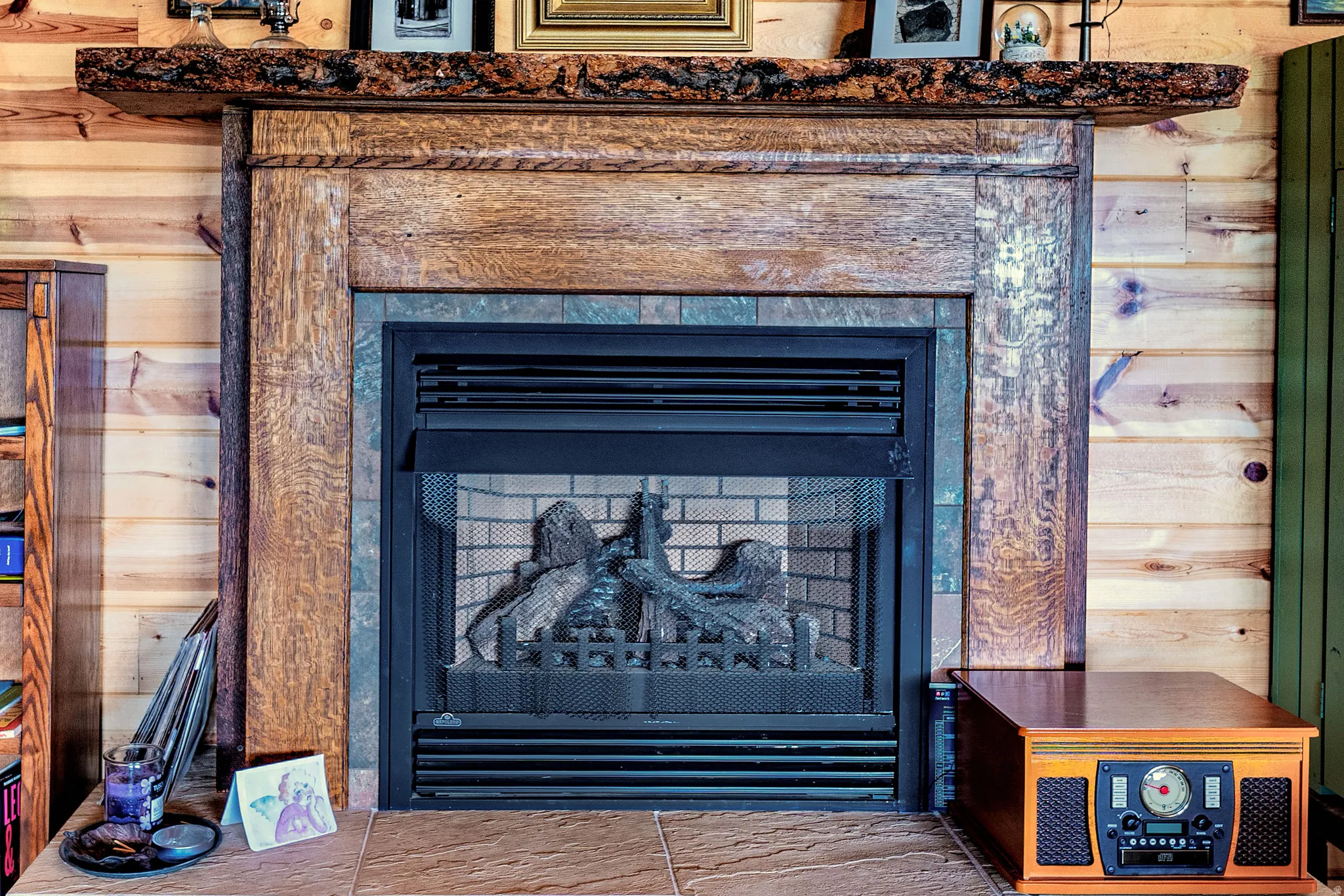 Natural wood mantel with a live edge top and decorative corbels
