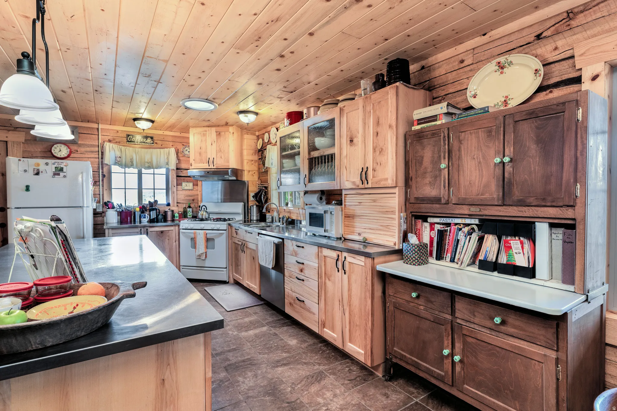 Kitchen featuring custom Stainless-Steel countertops.