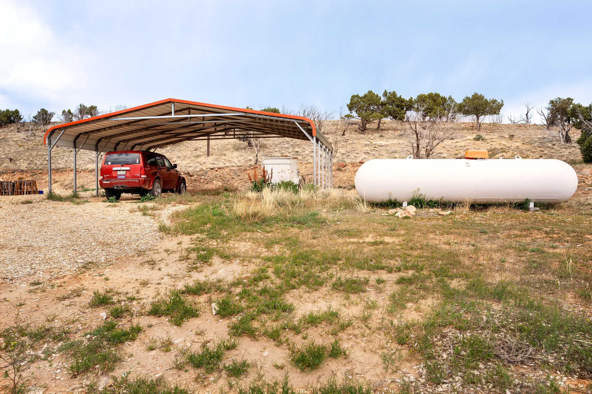 Metal carport structure featuring a pitched roof