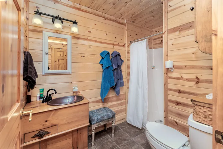 3/4 bath with walk-in shower and antique vanity