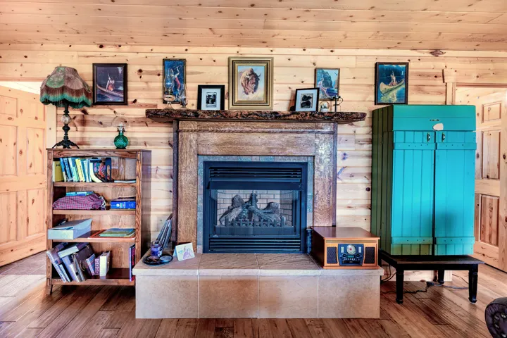 Central fireplace with a stone surround and hearth