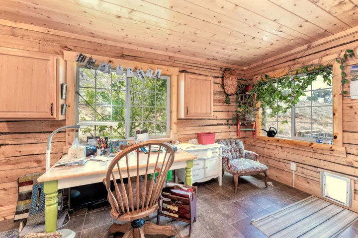 Large utility room with plenty of space for an office/work/crafting space.