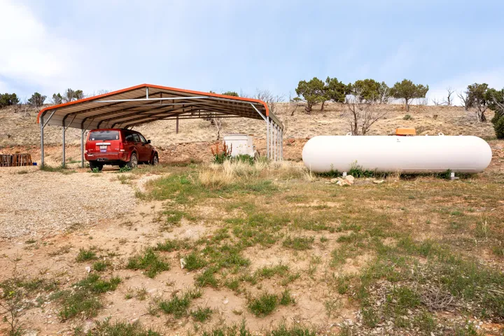 Metal carport structure featuring a pitched roof