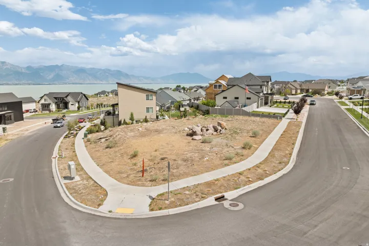 Generous corner lot with established curb and sidewalk infrastructure