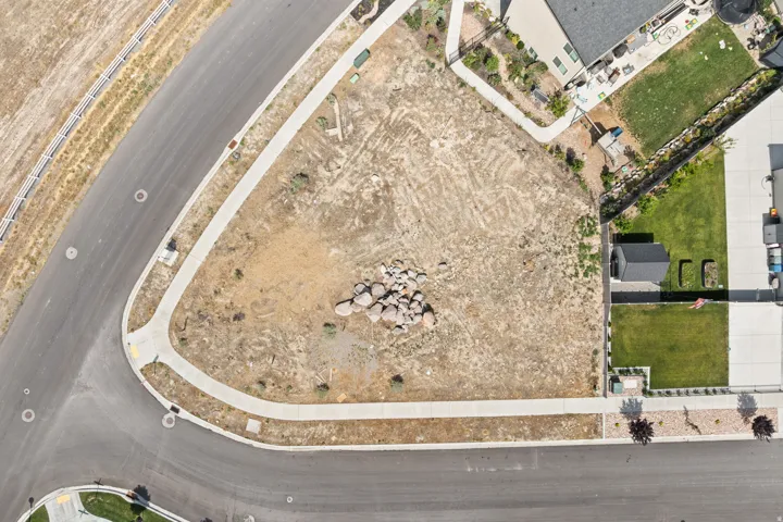 Corner lot with established sidewalks and paved street frontage