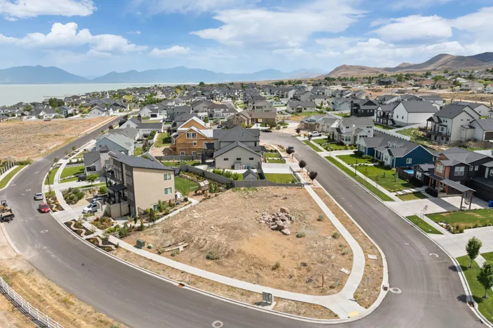Corner residential lot featuring an open landscape and paved street frontage