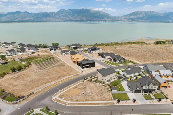 Expansive residential development featuring paved roads and a variety of contemporary home styles