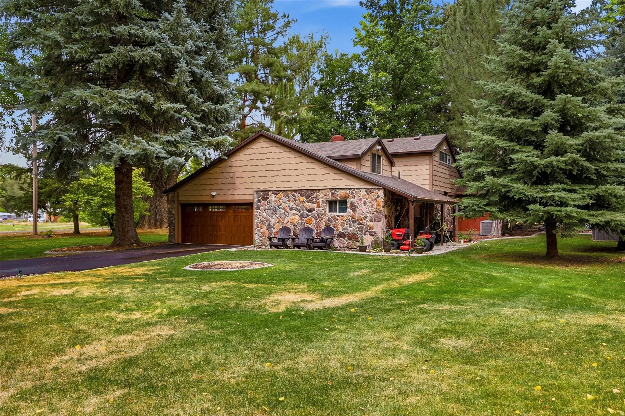 Exterior featuring a combination of stone veneer and wood siding