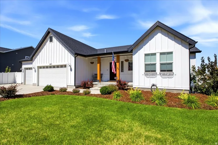 Modern farmhouse-style residence featuring white board-and-batten siding