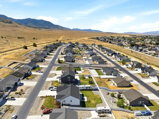 Newer residential development featuring single-story homes with dark shingle roofs