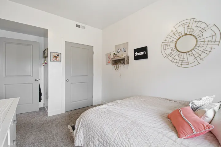 Interior room featuring light gray carpeting and white walls