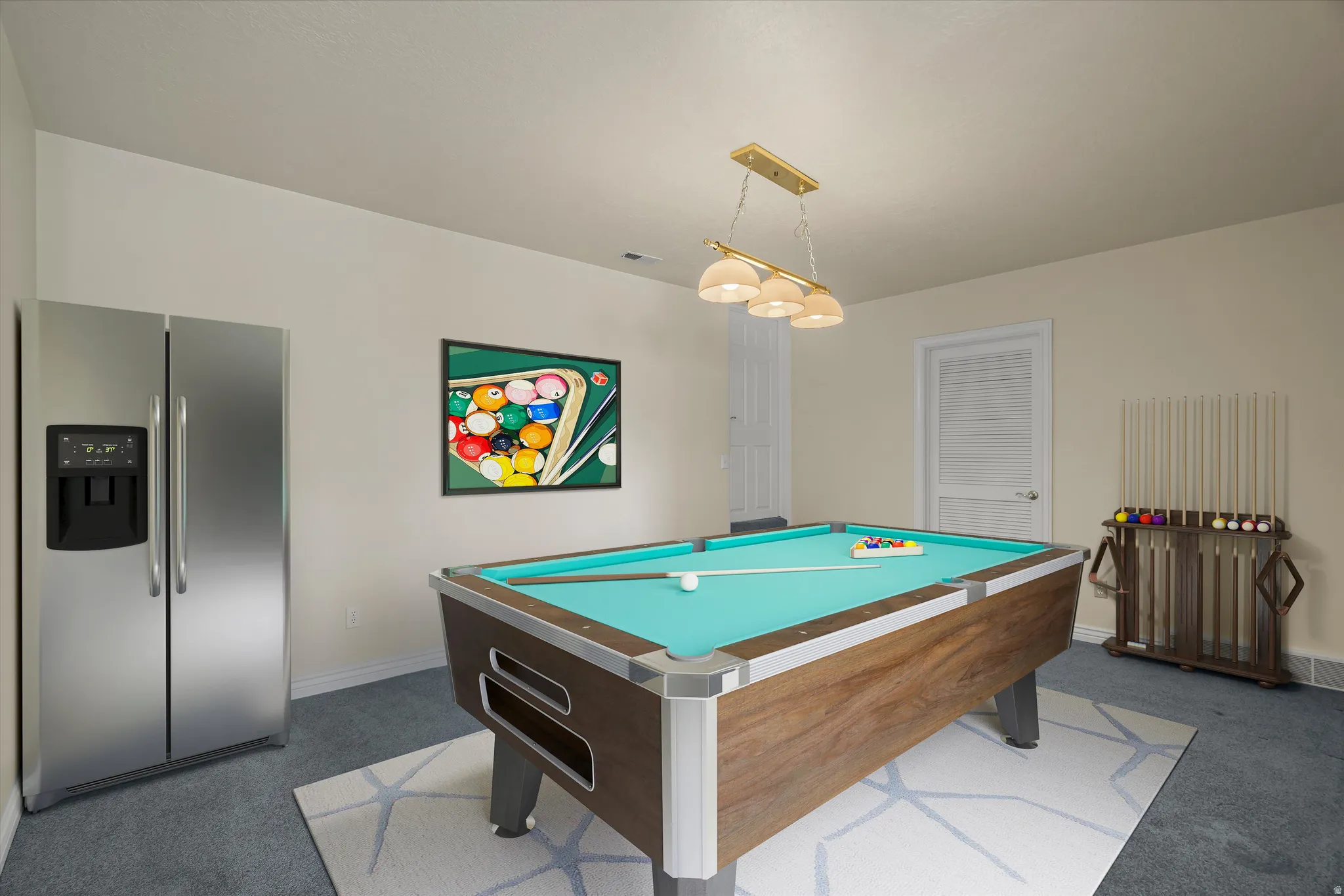 Recreational room featuring a billiards table with turquoise felt, recessed lighting, and a stainless steel side-by-side refrigerator