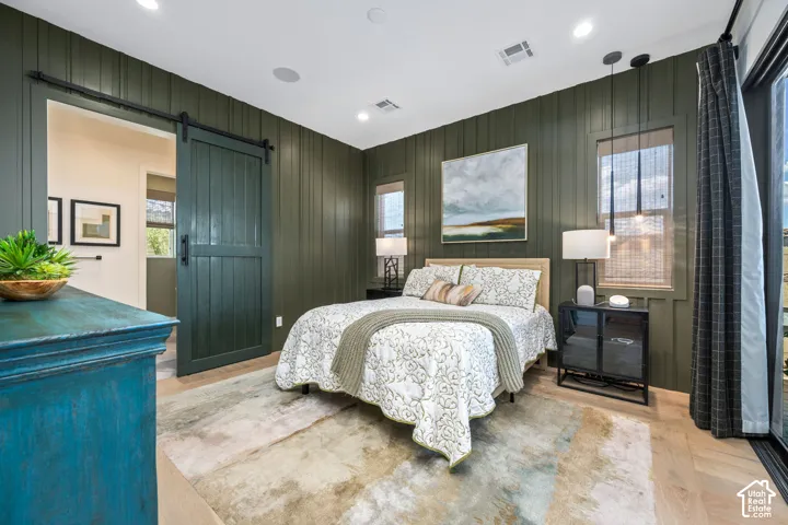 Wood-finish flooring with a barn door entry
