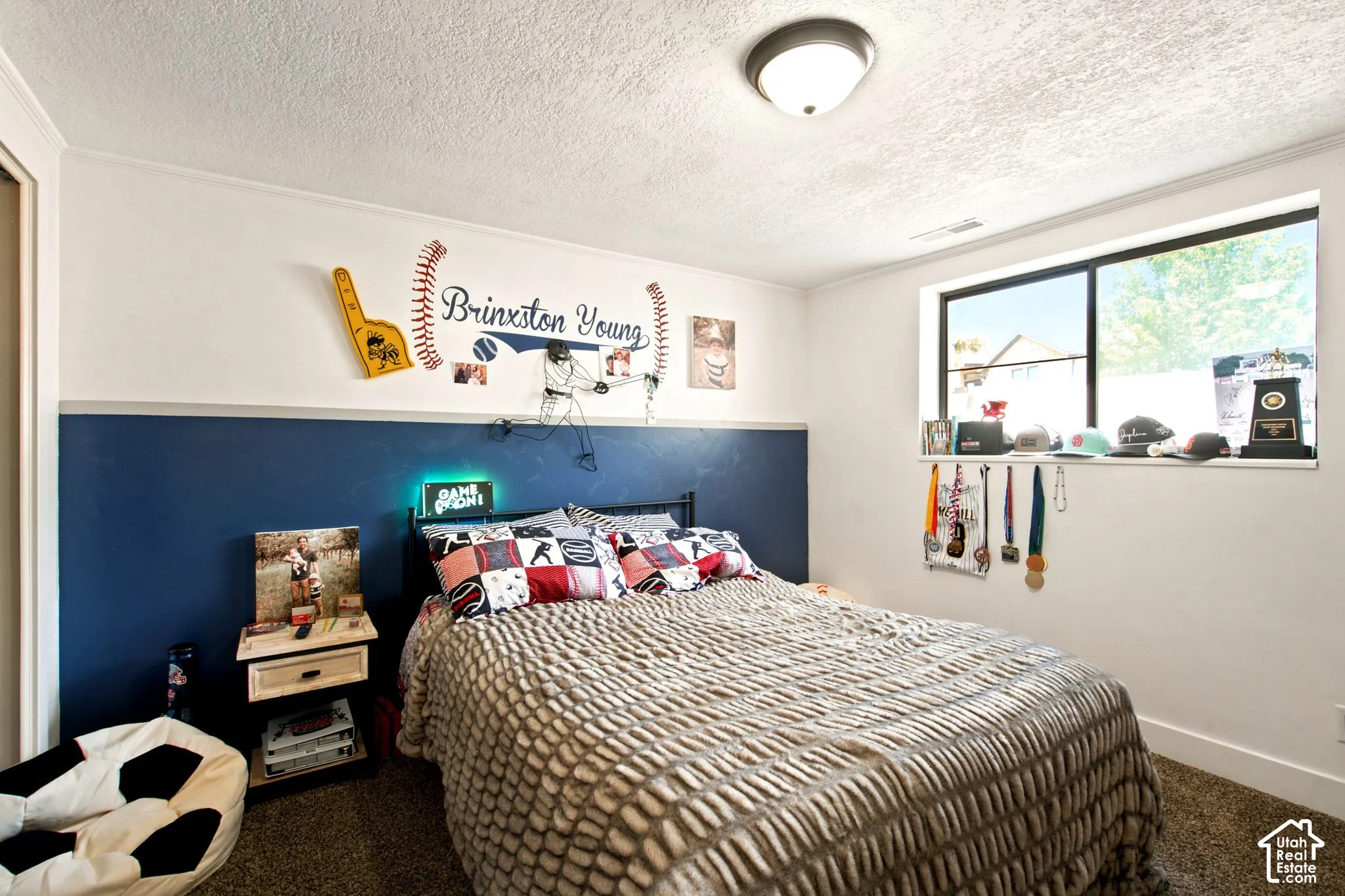 Room featuring two-tone wall paint, a single window, recessed lighting, and a dark carpet