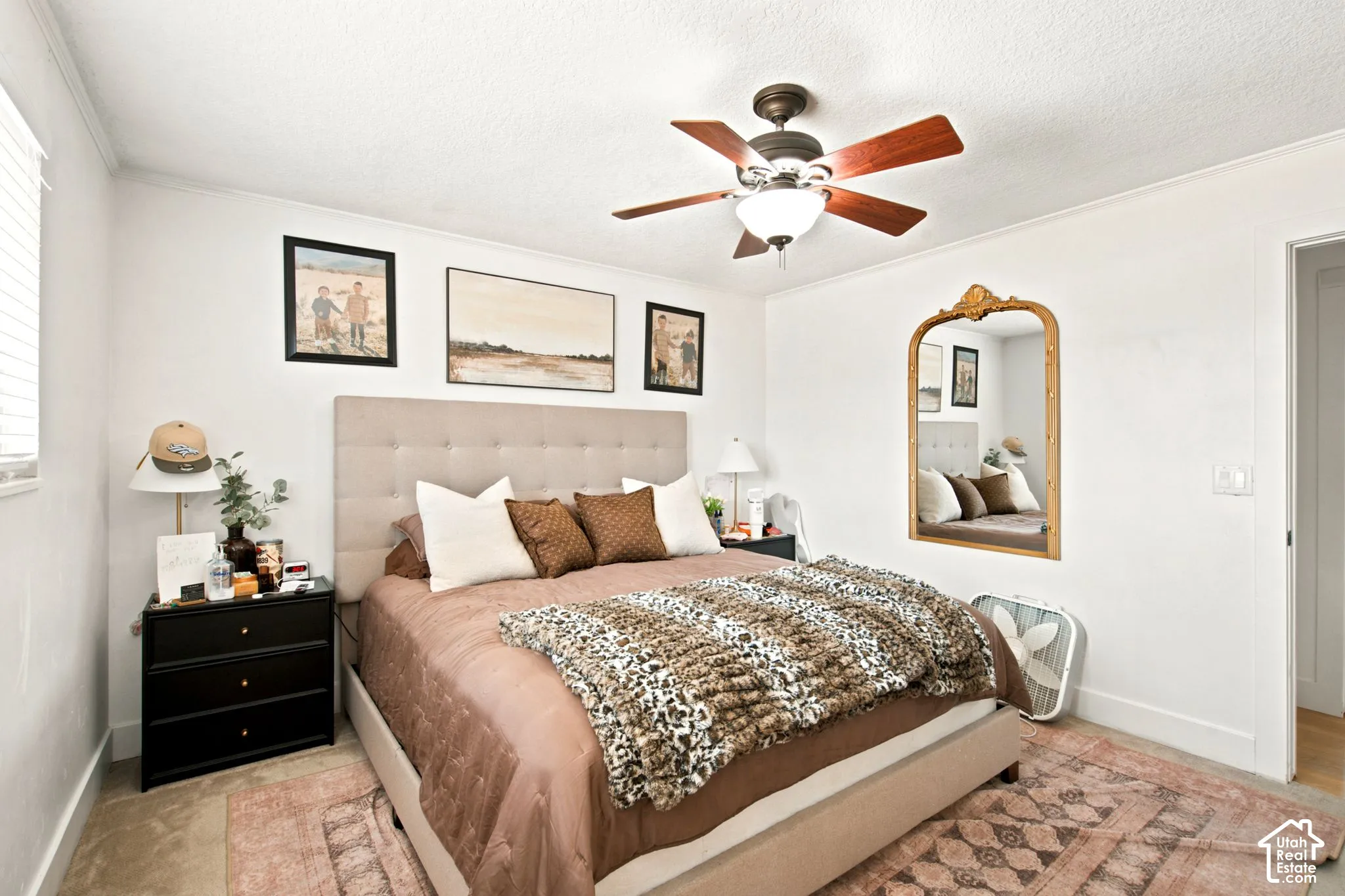 Bedroom featuring a neutral color palette, ceiling fan with integrated lighting, window with blinds, and white baseboards