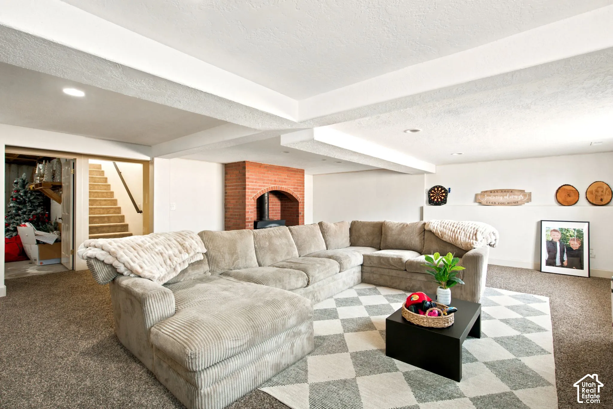 Spacious room featuring neutral carpeting and recessed lighting