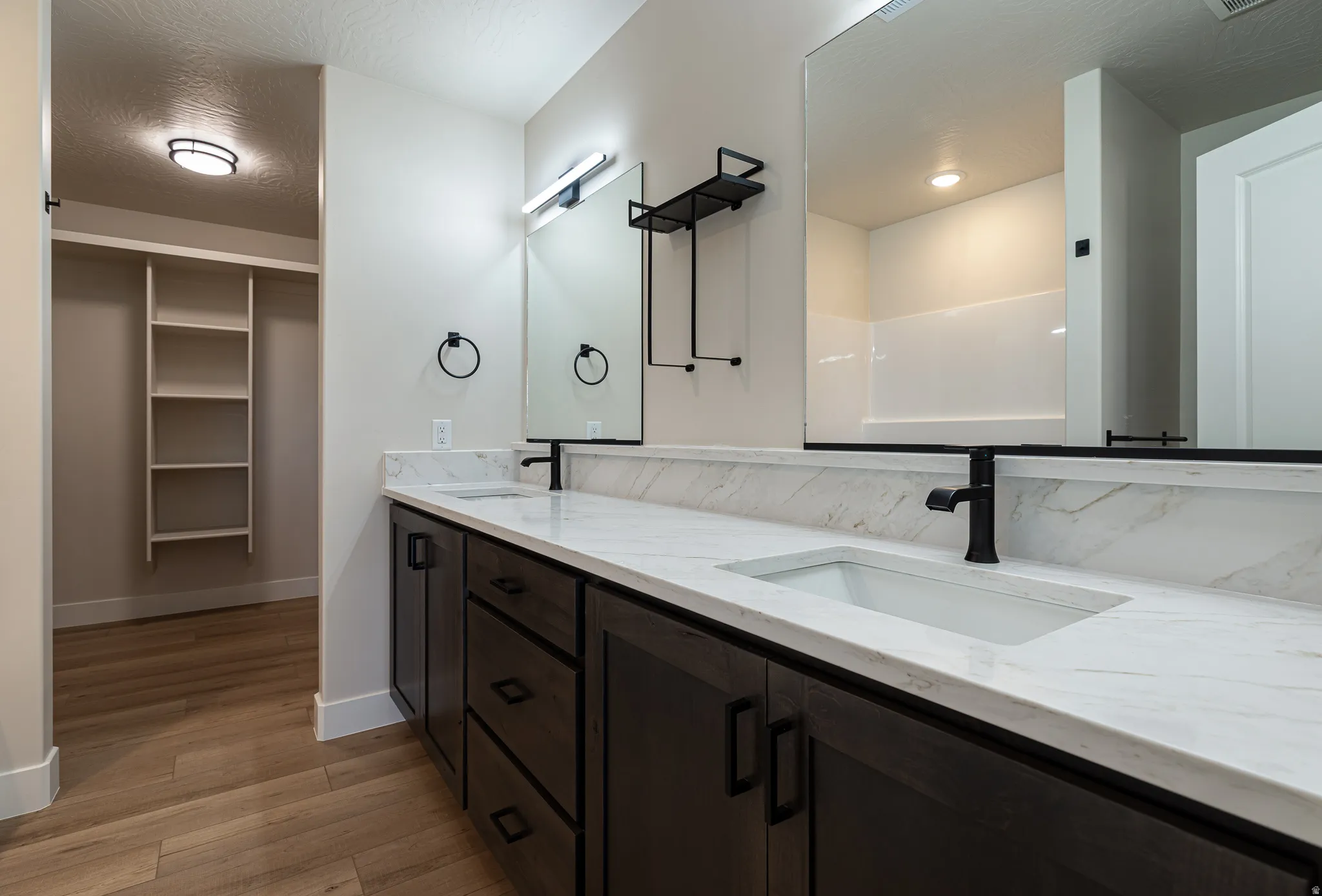 Dual vanity with white quartz countertops and integrated rectangular sinks