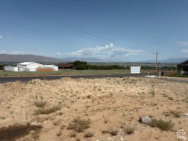 Undeveloped parcel featuring expansive land with distant mountain scenery