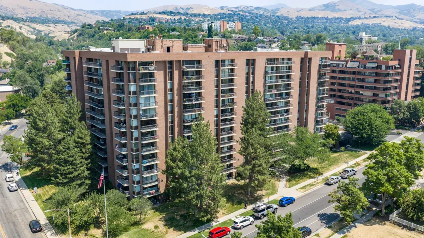 Multi-story brick building with multiple private balconies