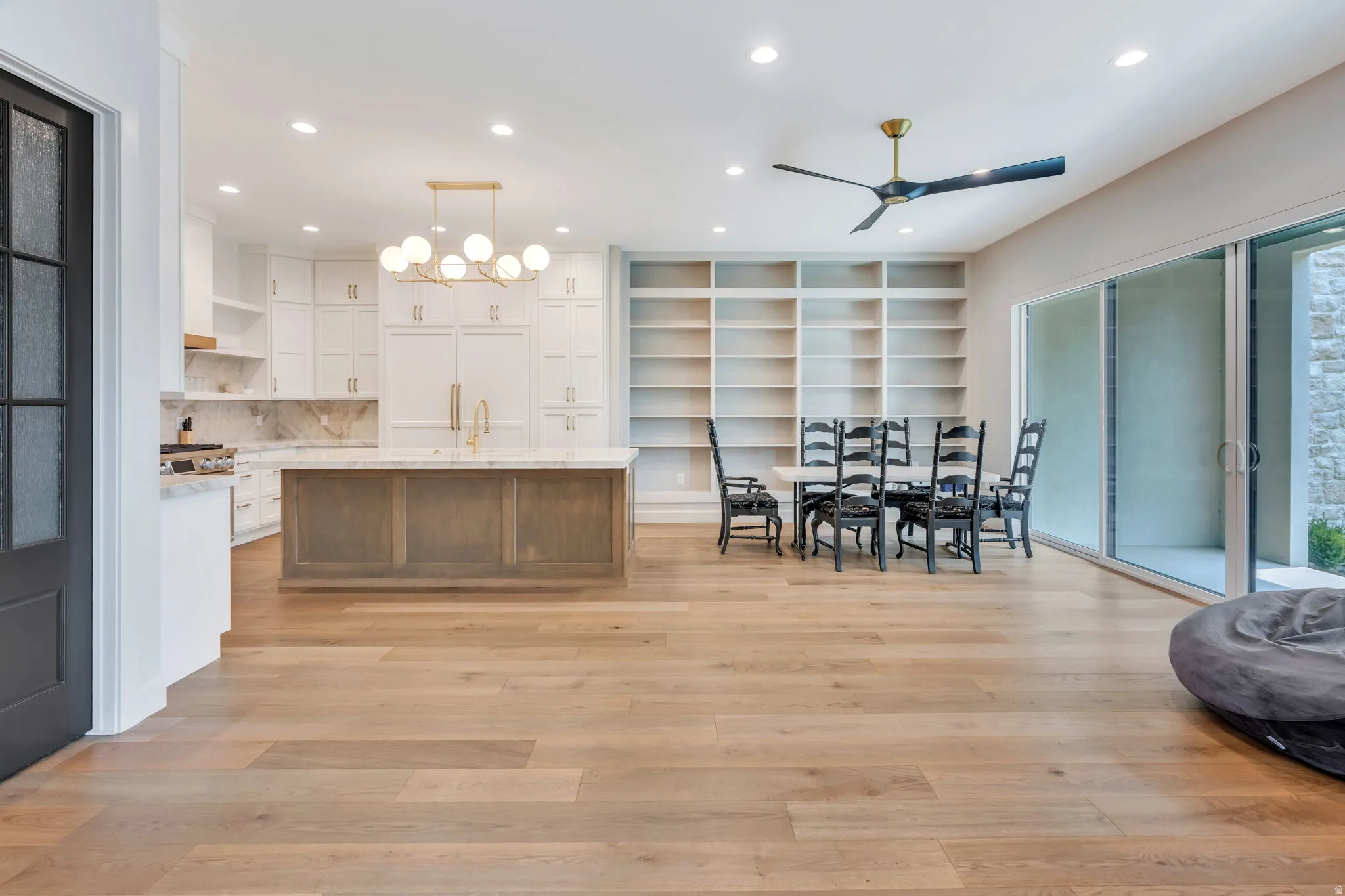 Open-concept interior featuring light wood-finish flooring