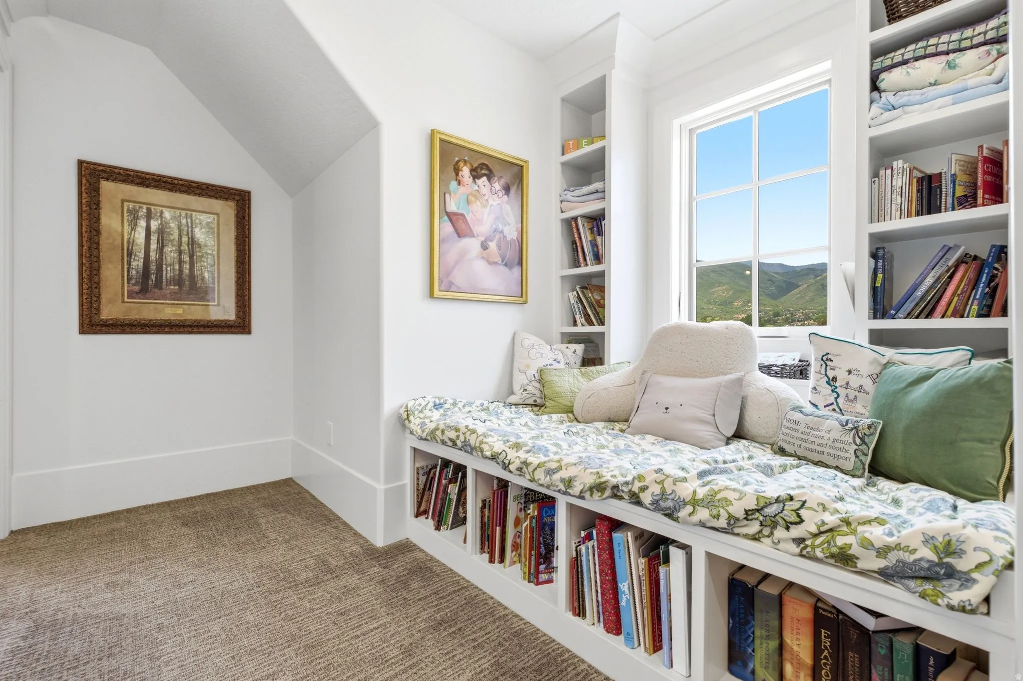 Window bench with integrated shelving, flanked by built-in bookcases