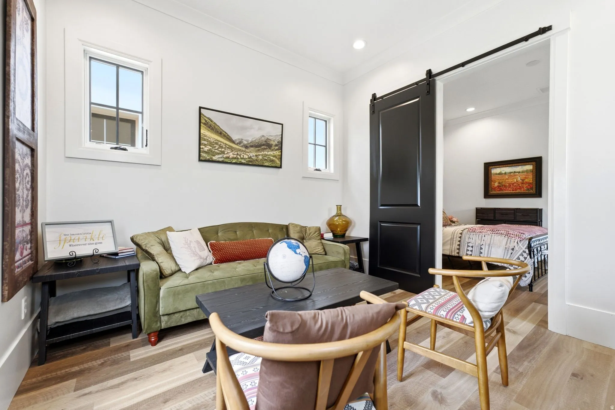 Bright interior space featuring wood-finish flooring, white walls, and recessed lighting