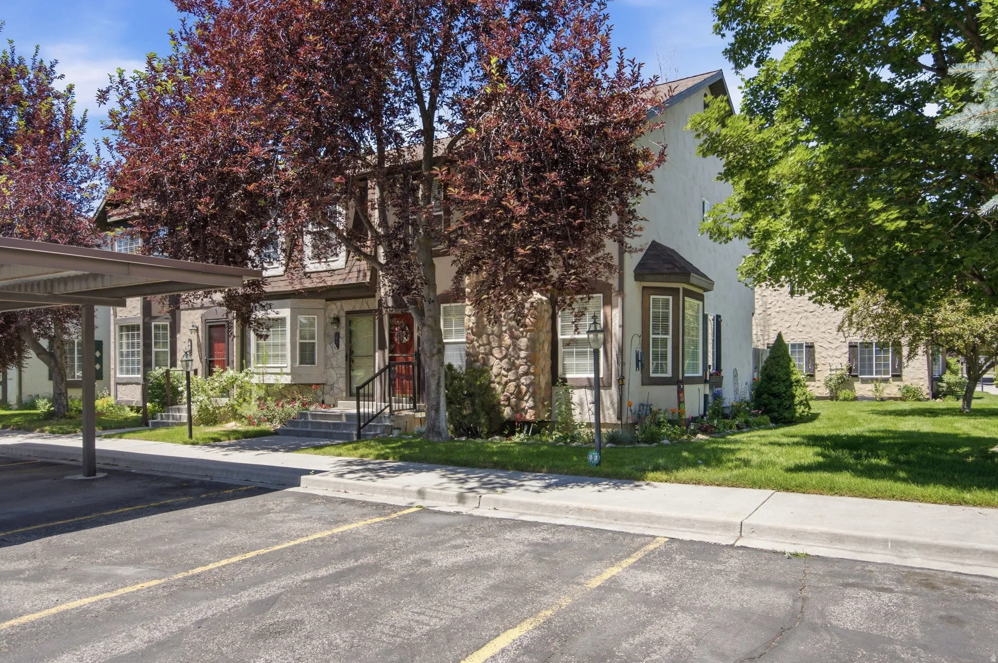 Carport parking area with adjacent concrete walkway