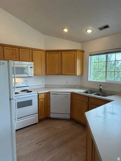 AMAZING VIEW WINDOW over dual basin sink, and brand new luxury vinyl plank floors!