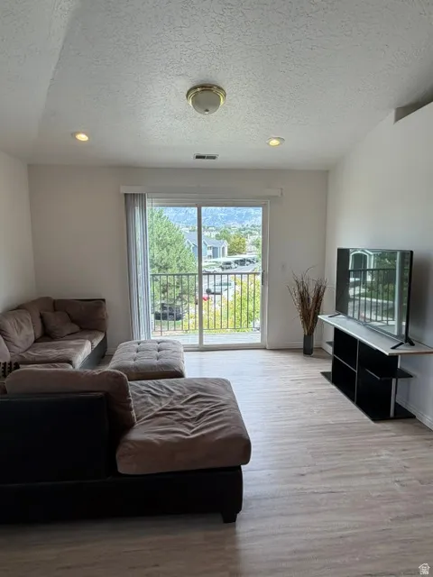 VIEWS ABOUND off the spacious living area featuring brand new LVP flooring!
