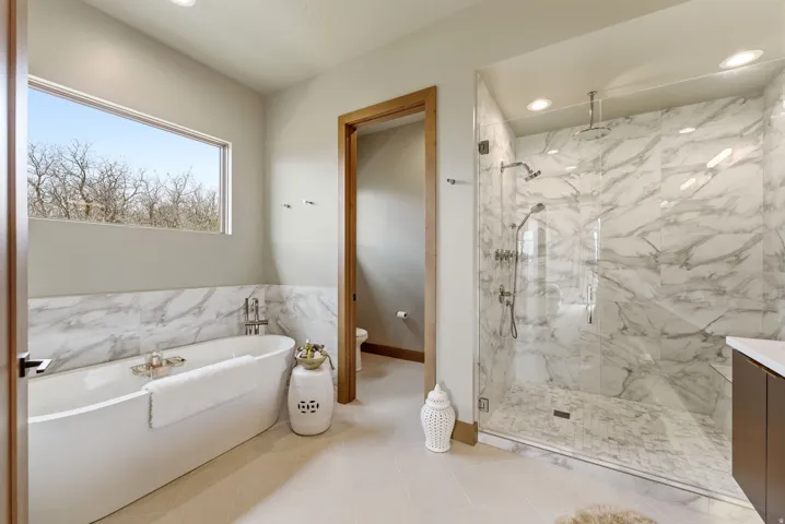 Freestanding soaking tub with a rectangular window above