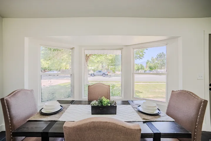 Bay window featuring three large panes and white trim