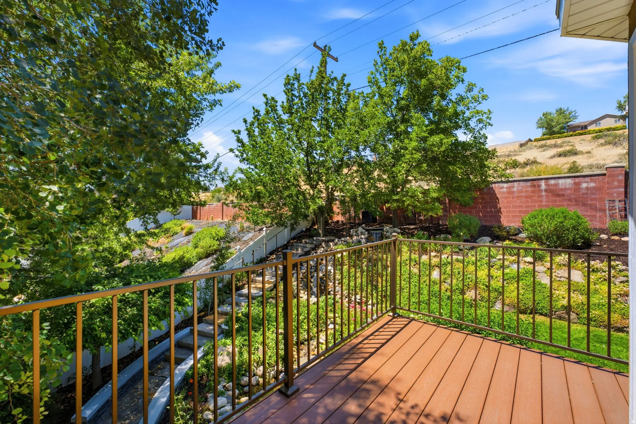 Outdoor deck featuring composite decking and bronze-finished railings