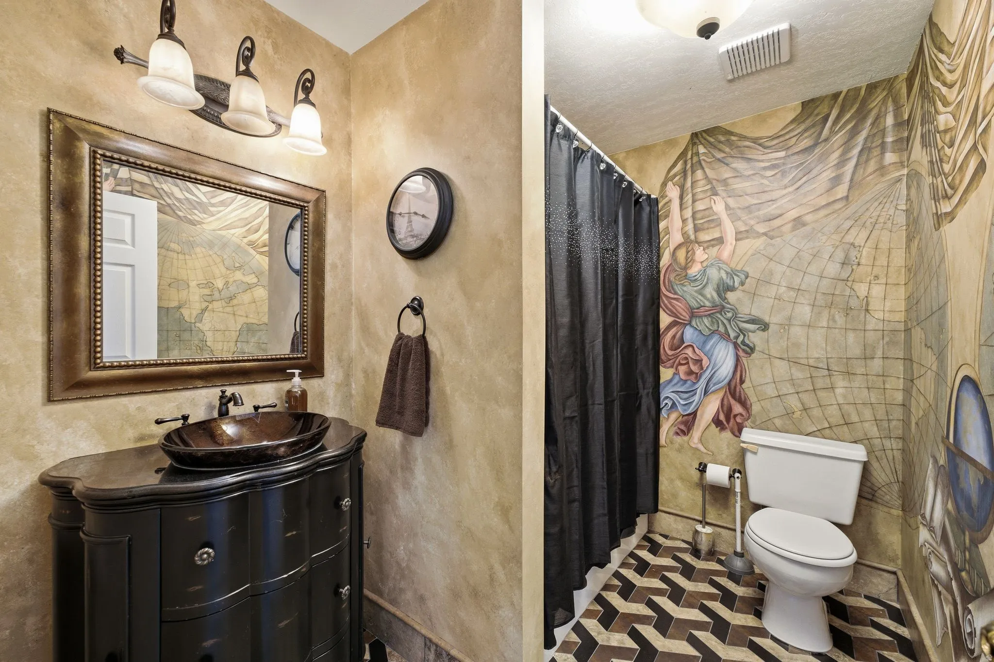 Powder room featuring a unique wall mural and a custom vanity with an oval vessel sink