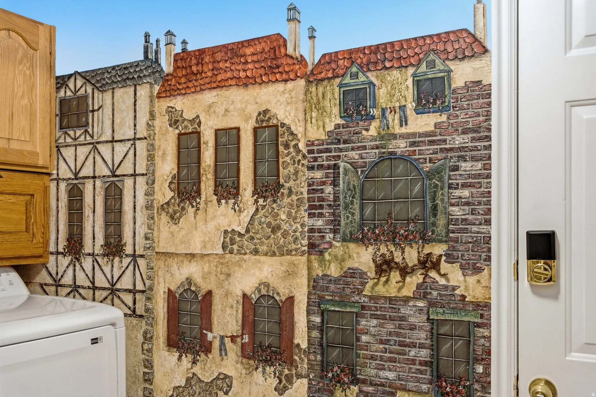 Interior Detail. Illustrating a decorative wall covering depicting building facades