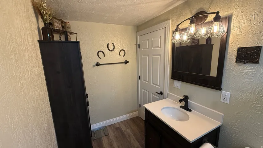 Vanity with integrated sink, matte black faucet, and white countertop