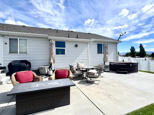 Expansive concrete patio area offering significant outdoor living space