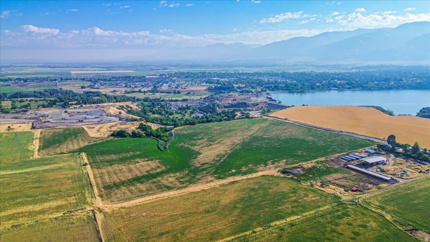 Expansive agricultural land featuring a mix of green fields and golden cultivated areas