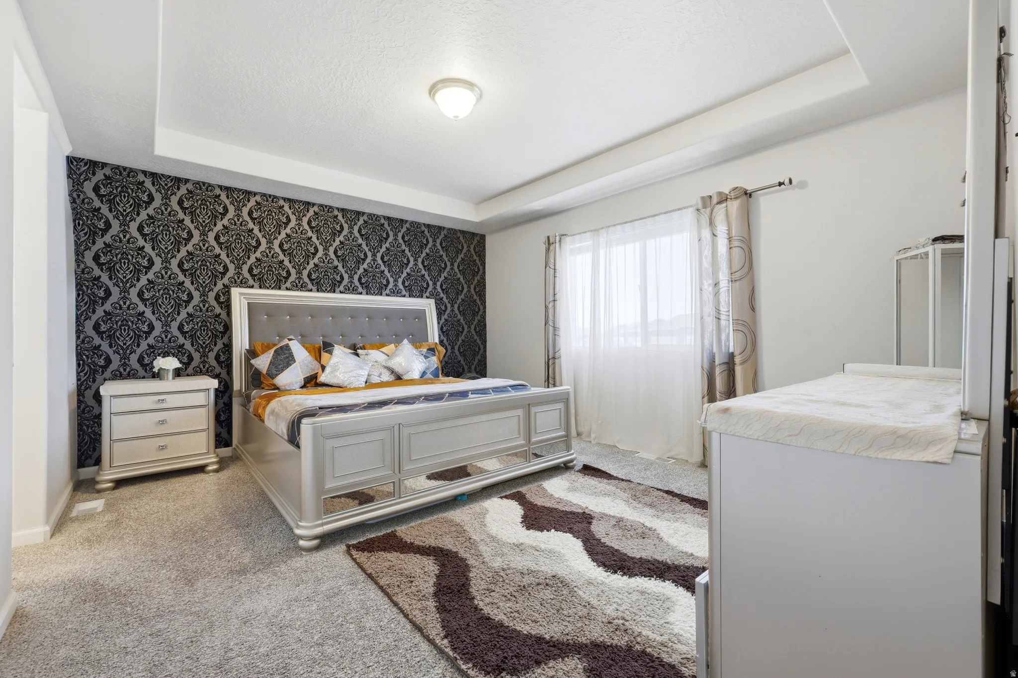 Recessed tray ceiling with a central flush-mount light fixture