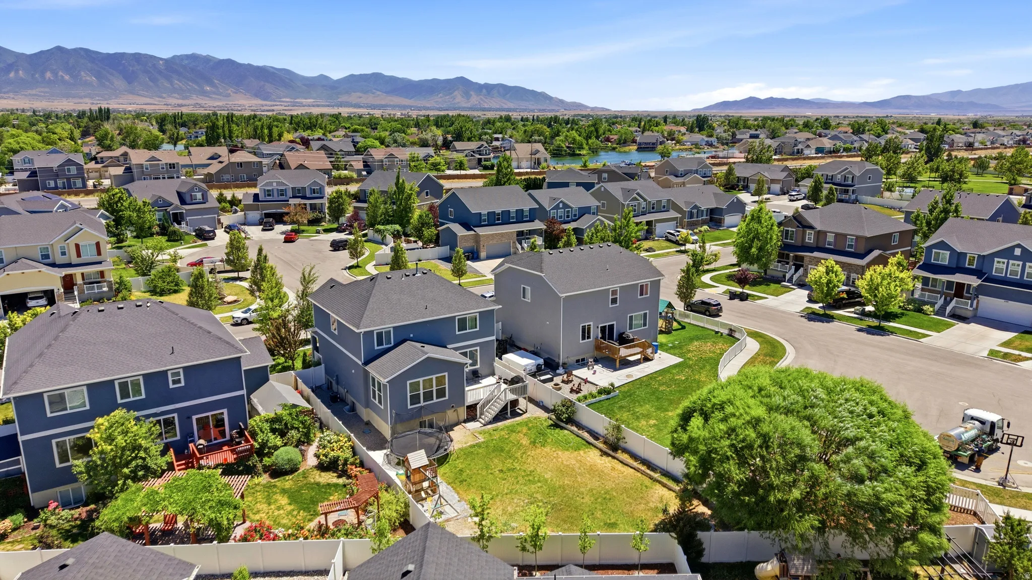 Residential neighborhood with a variety of two-story homes featuring a mix of siding and stone exteriors
