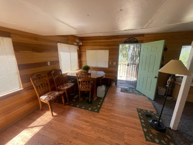Interior space featuring wood-finish flooring and plank wood wall finishes
