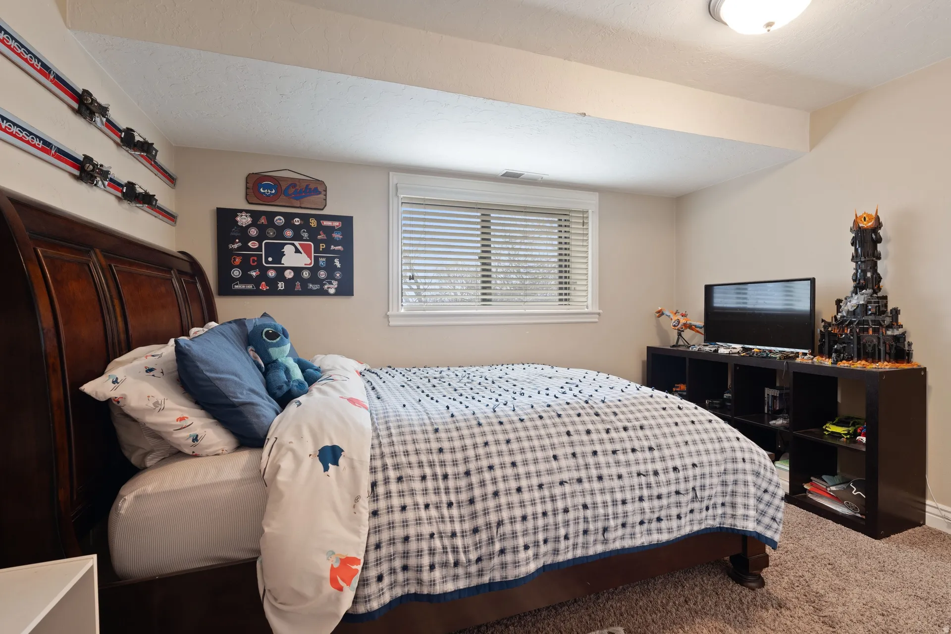 Neutral-toned walls complement the textured brown carpeting