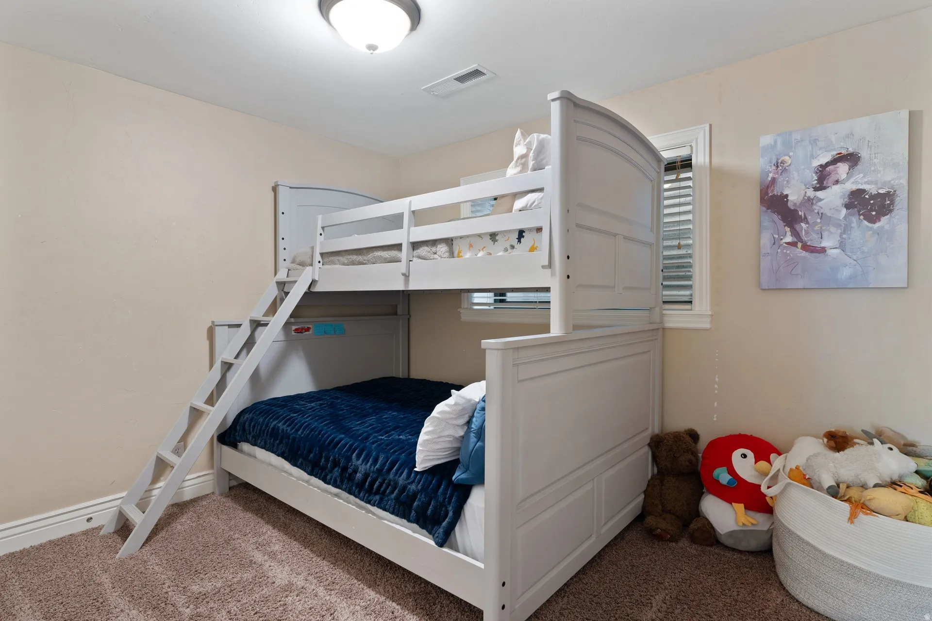 Room featuring light-toned walls, a window with horizontal blinds, and a semi-flush mount ceiling light fixture