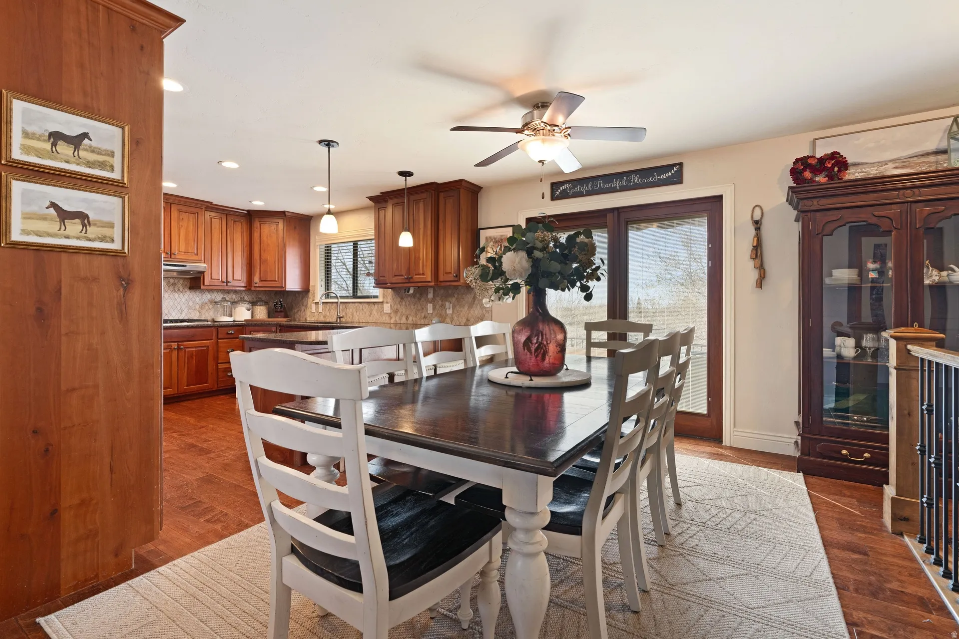 Open concept dining space with wood-finish flooring